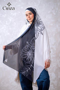 Woman wearing black and white printed chiffon hijab with floral design