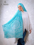 Woman wearing turquoise printed chiffon hijab with mandala pattern