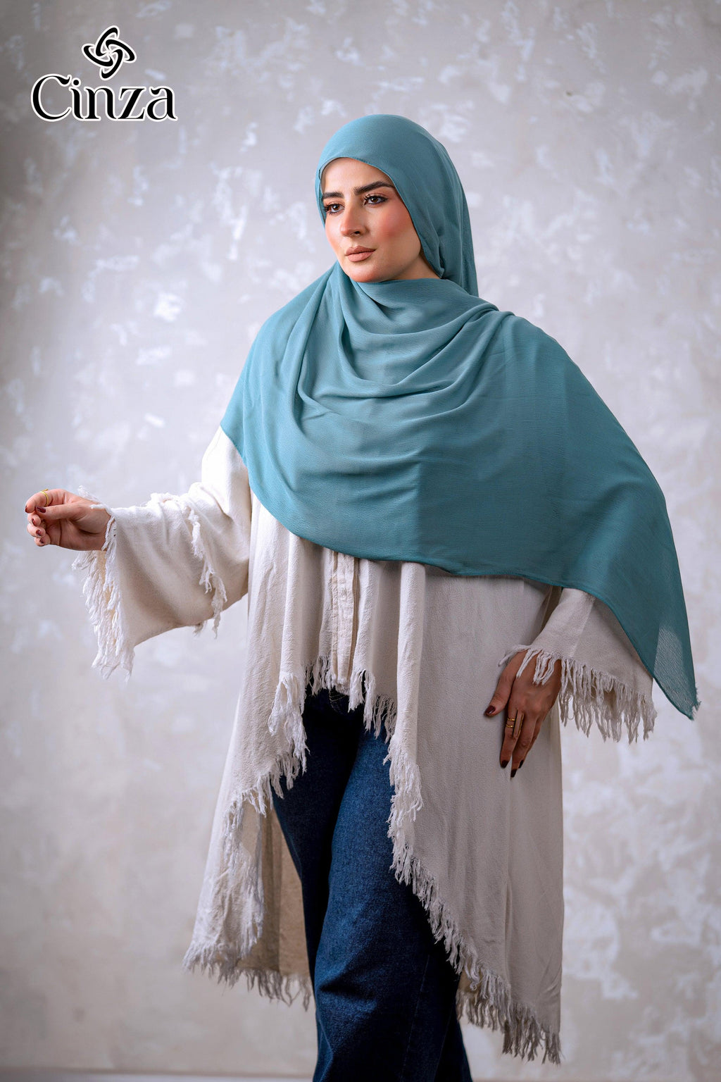 Teal green cotton hijab styled on model